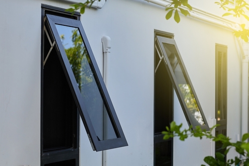 Aluminium casement window on grey wall image