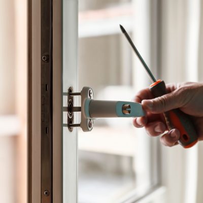 A hand changing a white window handle image