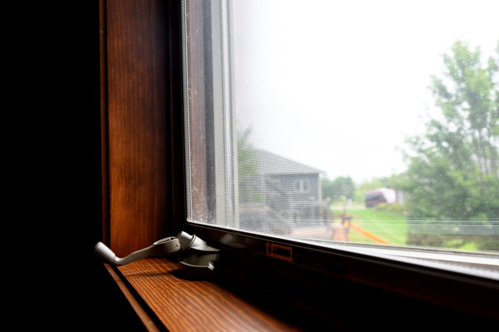Dark brown traditional casement window 