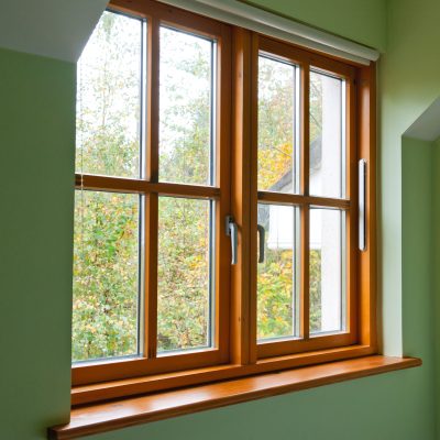Wood window on green background